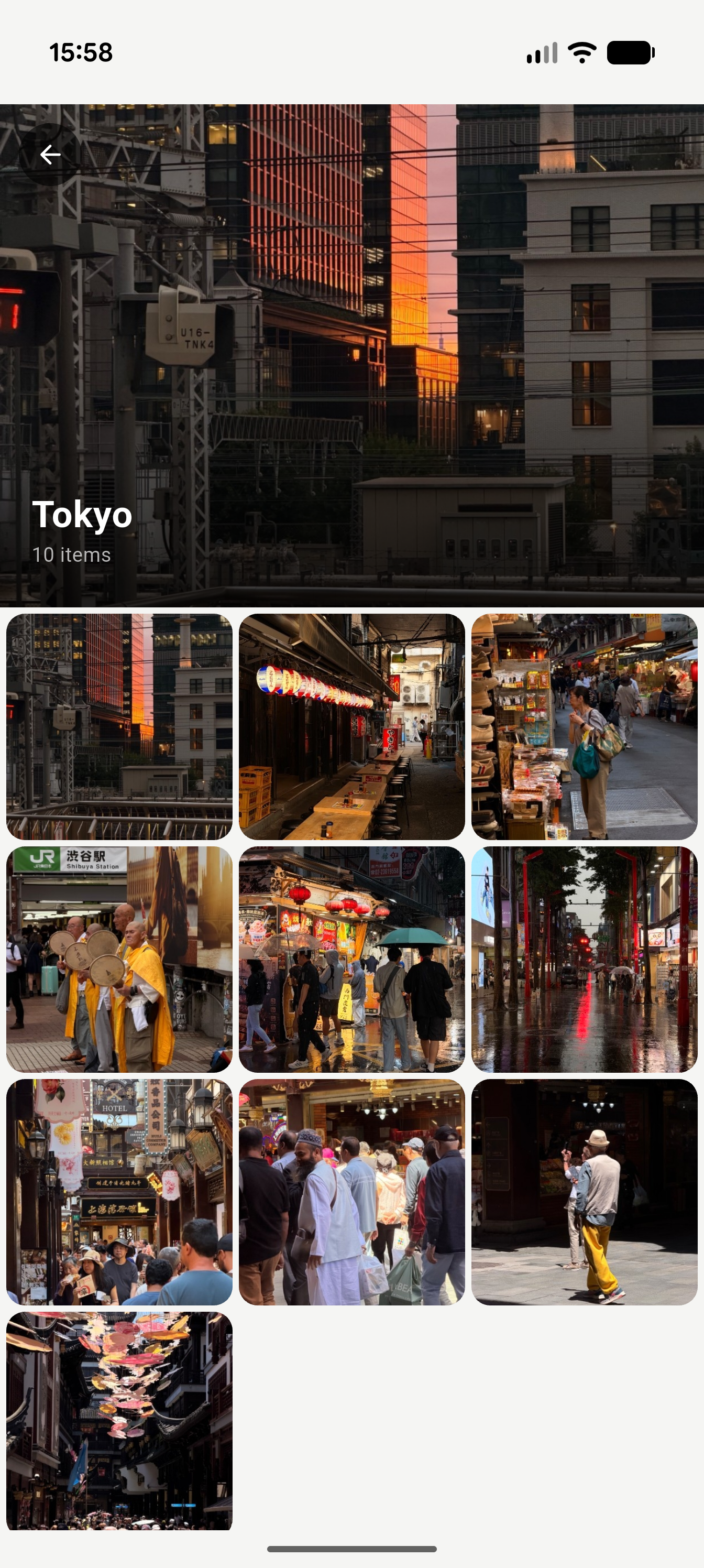 Tokyo album opened, showing ten photos